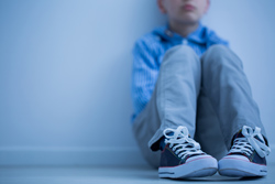 Autism Spectrum Disorder - Child sitting alone