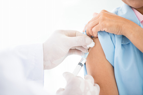 Immunization and Vaccinations - Image of a patient getting a vaccine
